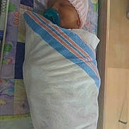 Brinnleigh is registered to the contest to win money with this photo: newborn, baby, infant, pacifier, blanket, crib, sleeping, hospital, hat, child, swaddled, bed, bedding, person, resting, cute, indoors, soft, comfort, peaceful