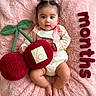 baby, infant, child, portrait, lying_down, smiling, pink_blanket, fluffy_blanket, red_yarn, yarn_ball, plush_toy, leaf_prop, baby_clothing, bib, hair_bows, bare_feet, nursery, cozy, flat_lay, photography