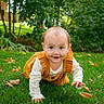 Aurora is registered to the contest to win money with this photo: autumn_leaves, baby, child, clothing, crawling, curious, cute, daylight, face, fall, garden, grass, greenery, head, nature, outdoor, person, playful, smiling, young_child