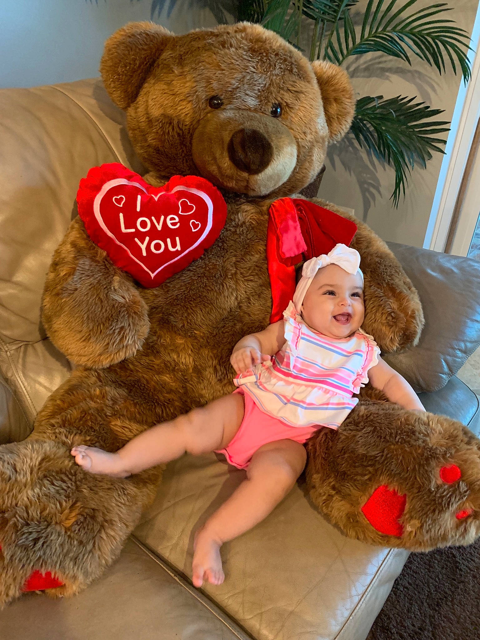 Mila Rose is registered to the contest to win money with this photo: bear, child, friendship, fur, furniture, happy, headwear, hug, love, person, plush, room, smile, stuffed_toy, teddy_bear, toy, valentines_day