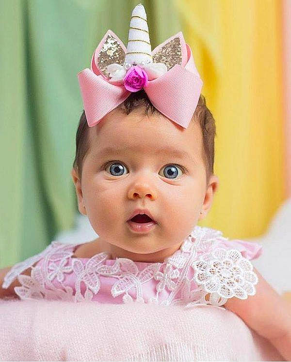 Amy joined the competition — help win amazing prizes! baby, birthday, child, child_model, clothing, costume_accessory, costume_hat, crown, ear, fashion_accessory, hair_accessory, hat, head, headband, headgear, headpiece, party_hat, party_supply, person, pink