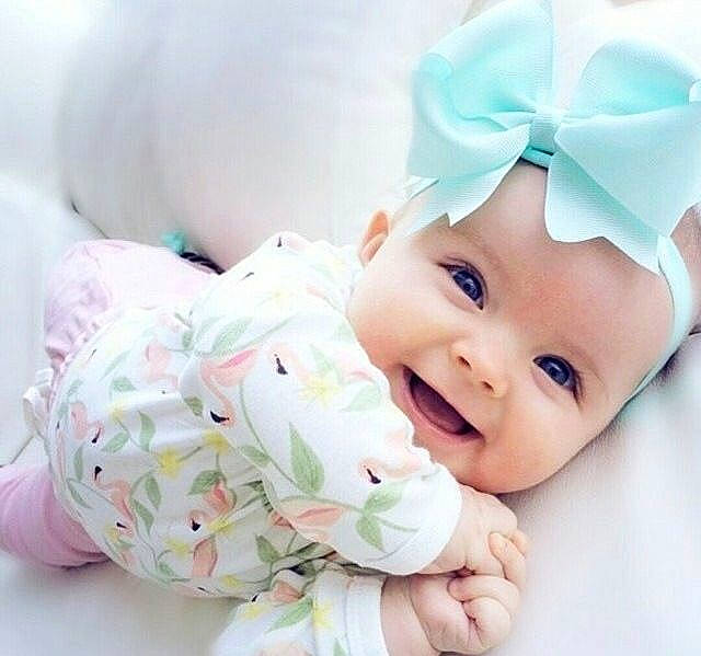 Lily is registered to the contest to win money with this photo: baby, baby_products, baby_sleeping, baby_toddler_clothing, child, ear, fashion_accessory, hair_accessory, hand, head, headband, headgear, person, pink, product, skin, smile, toddler