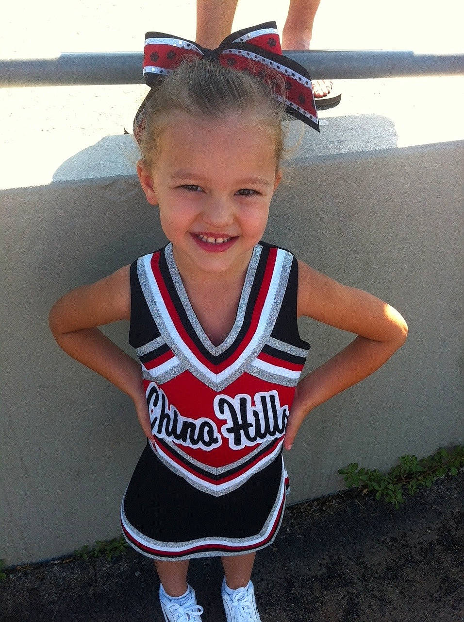 Bri joined the competition — help win amazing prizes! cheering, cheerleading, child, child_model, joy, person, sports_uniform, team_sport, uniform