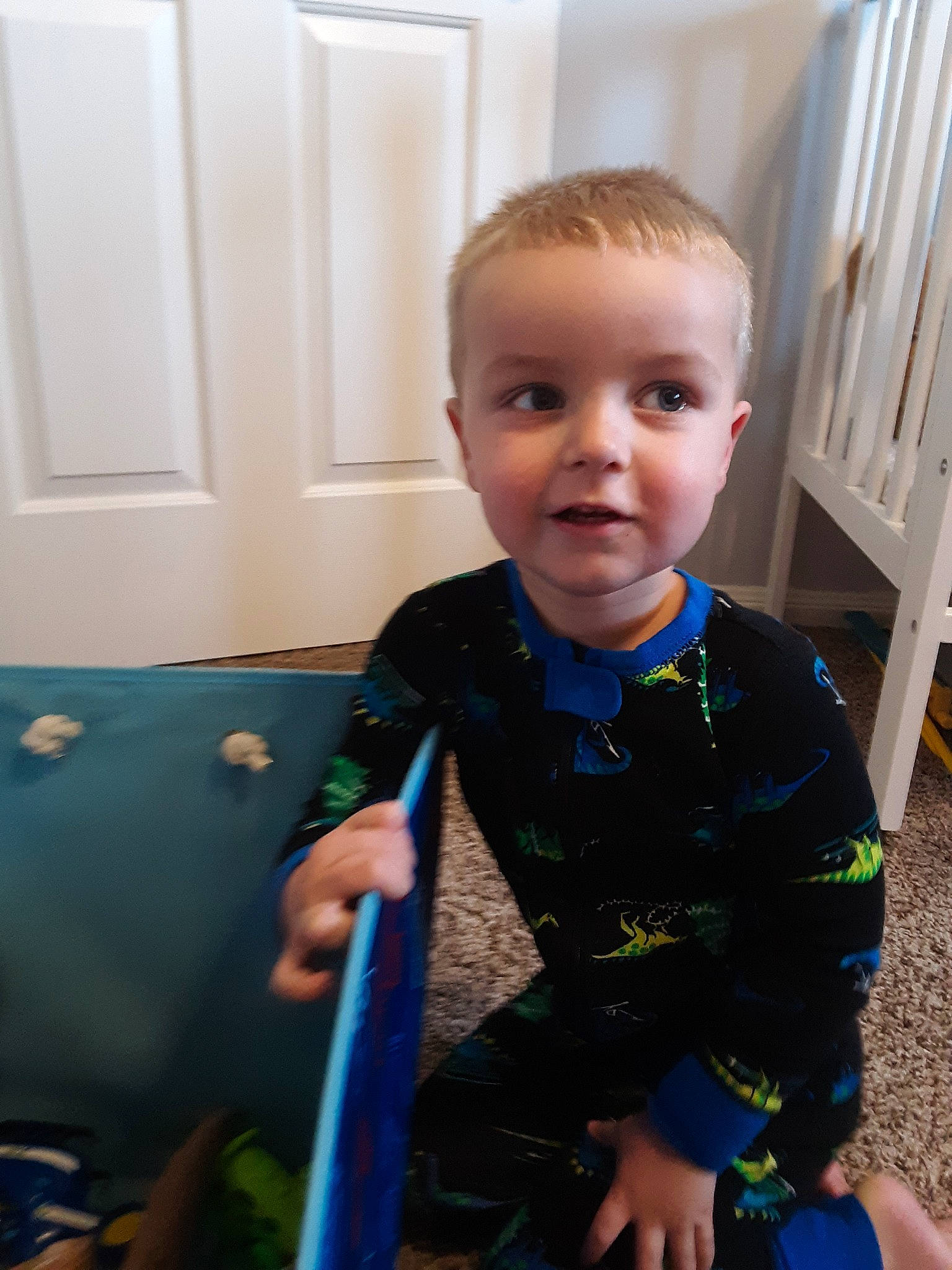 Colt is registered to the contest to win money with this photo: baby, baby_products, cheek, child, face, head, leg, person, play, product, room, sitting, skin, smile, standing, toddler