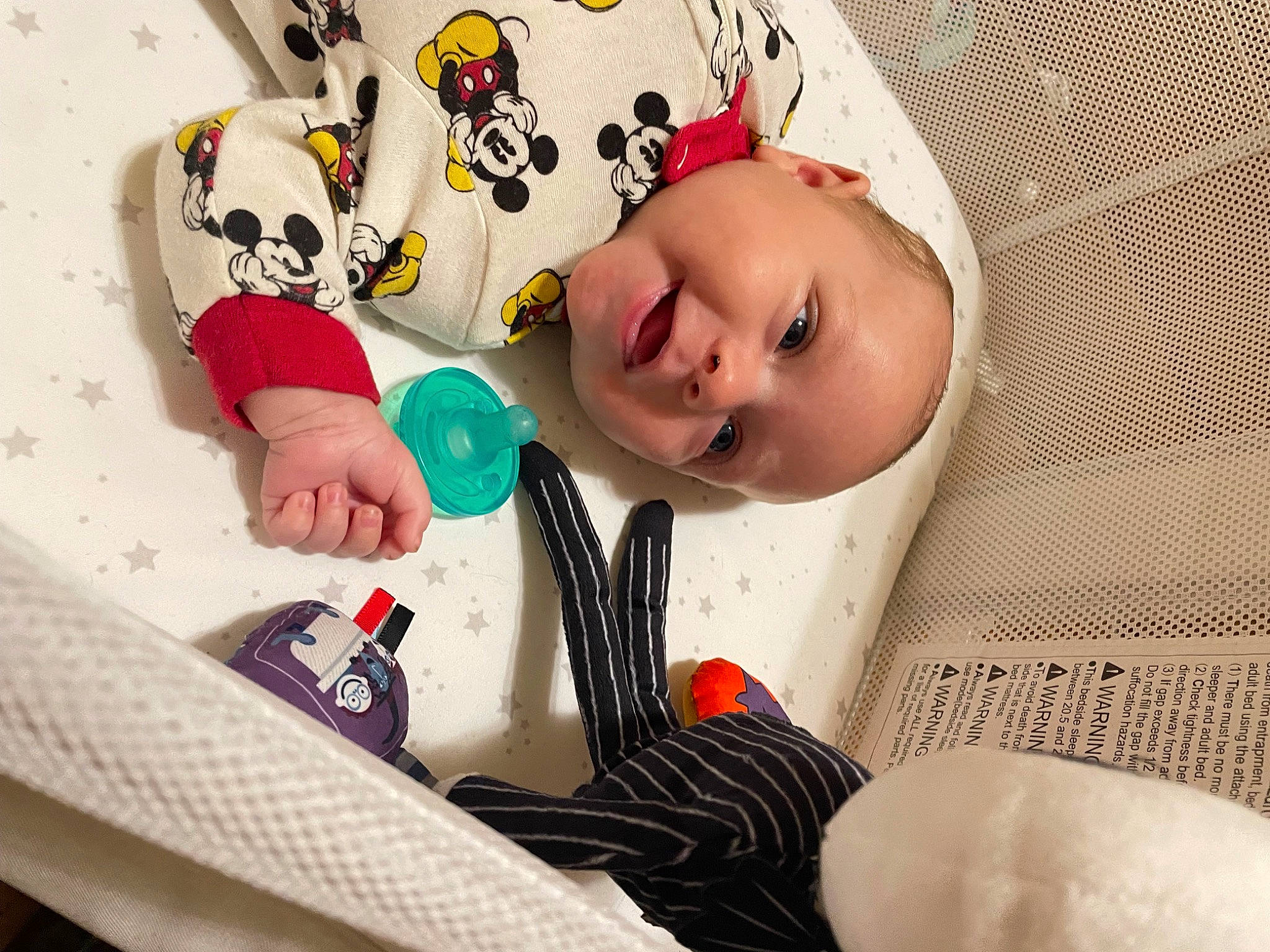 Leon is registered to the contest to win money with this photo: baby, baby_products, baby_sleeping, baby_toddler_clothing, cheek, child, comfort, eye, eyelash, fashion_accessory, finger, happy, headgear, linens, nail, person, room, skin, sleeve, textile