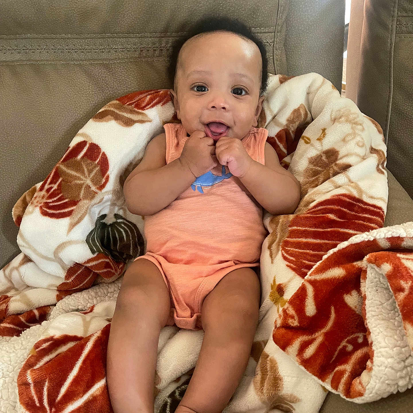 Aaden is registered to the contest to win money with this photo: baby, bed, blanket, bodypart, clothing, couch, cushion, face, finger, furniture, hand, head, homedecor, indoors, person, photography, portrait, quilt, shorts, sitting
