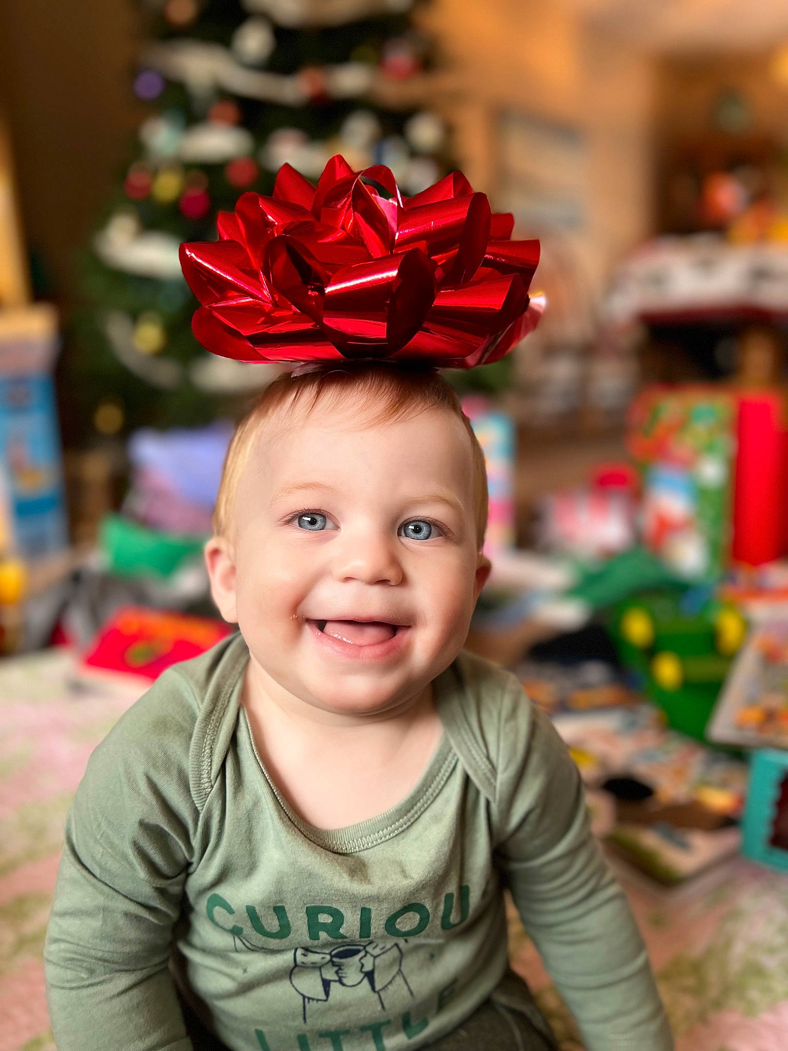 Cole joined the competition — help win amazing prizes! baby, cap, carmine, child, costume_hat, event, fashion_accessory, fun, happy, headpiece, helmet, joy, leaf, magenta, party_supply, person, petal, plant, sitting, smile