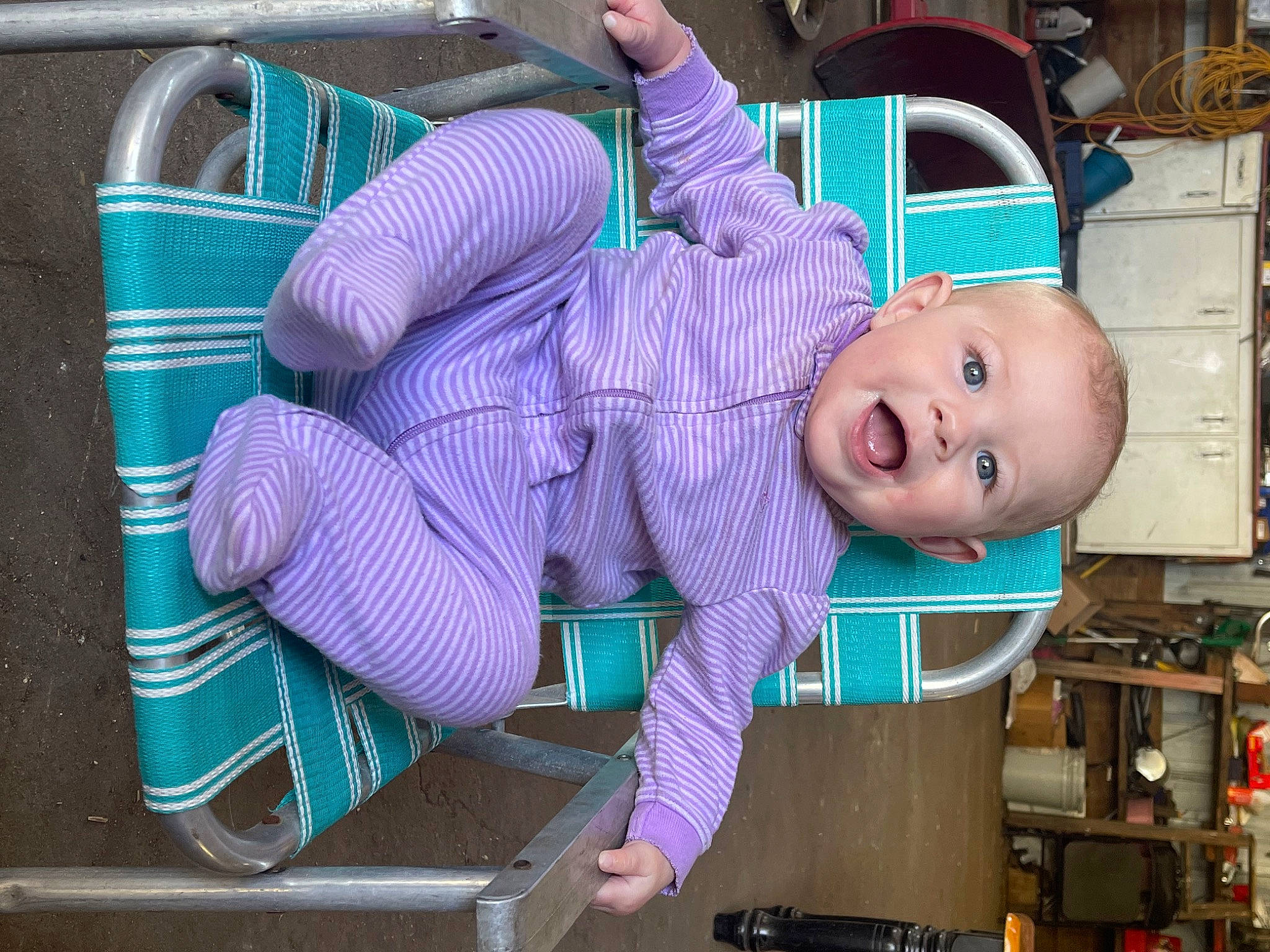 Oaklynn joined the competition — help win amazing prizes! baby, blue, child, electric_blue, fun, hat, machine, magenta, person, personal_protective_equipment, pink, purple, service, shelf, shelving, sitting, smile, suit, toddler