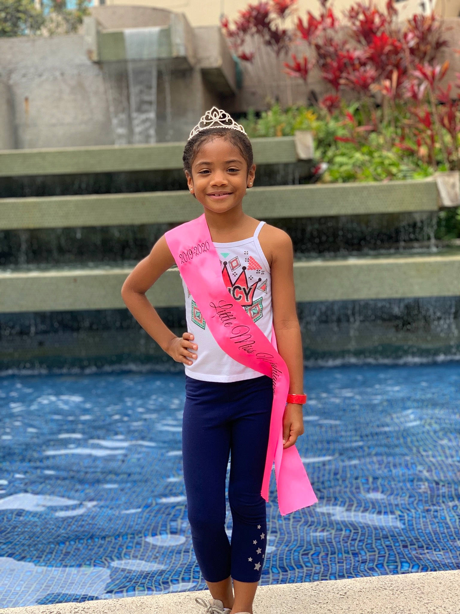 Desiree is registered to the contest to win money with this photo: child, child_model, clothing, joy, leisure, person, photography, pink, plant, sportswear, street_fashion, style, summer, t_shirt, vacation, water, yellow