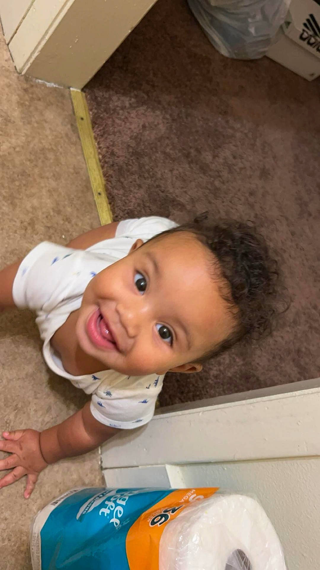 Brycen joined the competition — help win amazing prizes! baby, babylaughing, bathroom, crawling, door, face, happy, head, indoors, laughing, person, photography, portrait, room, smile, tape, toilet