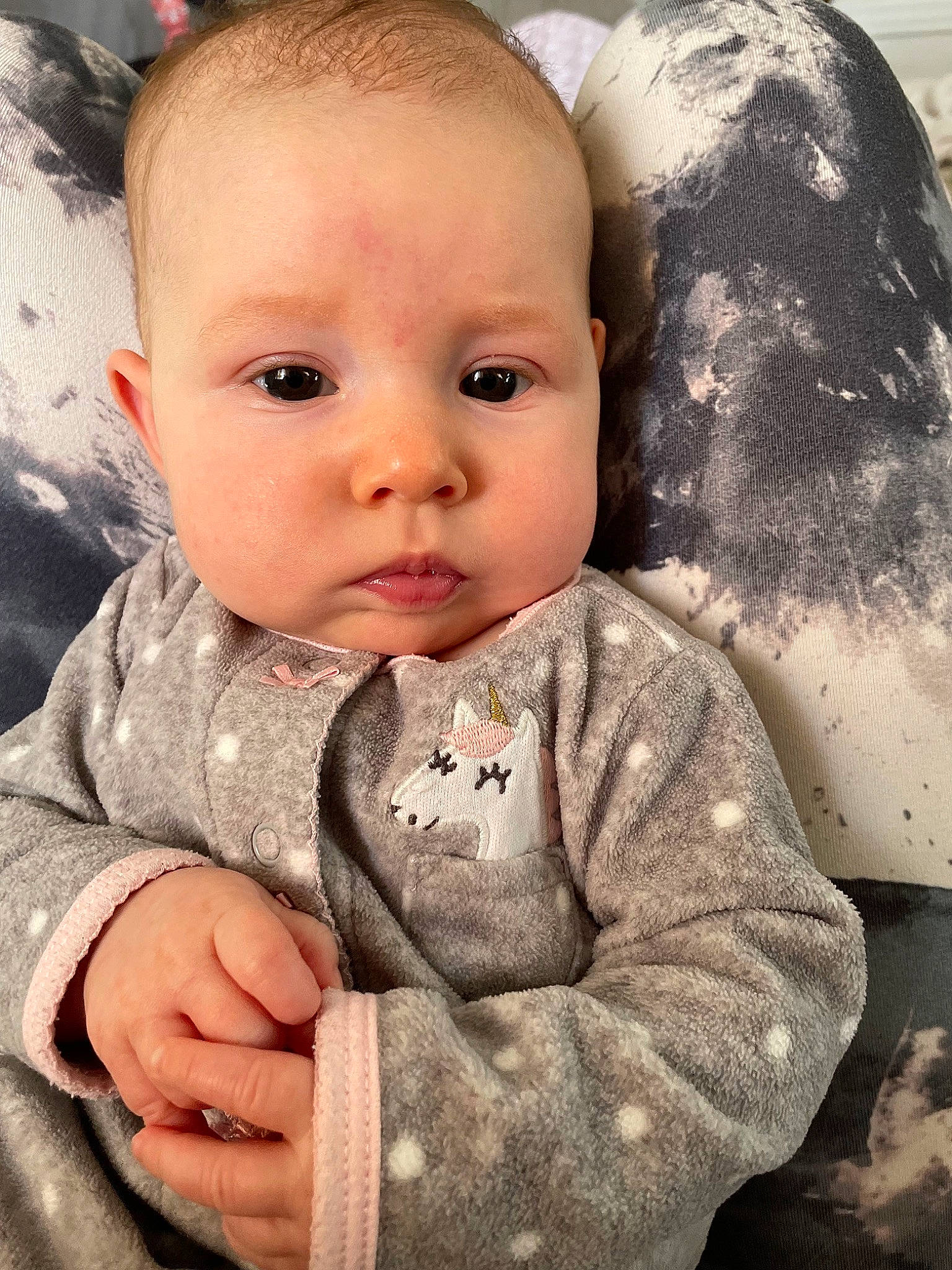 Luna-rae is registered to the contest to win money with this photo: baby, baby_toddler_clothing, cheek, child, comfort, cool, eye, gesture, hairstyle, happy, head, iris, linens, lip, mouth, nose, person, sitting, skin, sleeve