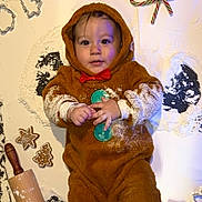 Anakin joined the competition — help win amazing prizes! baby, candy_canes, child, christmas, cookie_cutters, cute, festive, floor, flour, gingerbread_cookies, gingerbread_costume, holiday_decor, holiday_ornaments, indoors, infant, playful, portrait, red_bow, rolling_pin, smiling