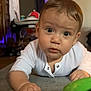 Anakin is registered to the contest to win money with this photo: baby, carpet, child, closeup, colorful, crawling, curious, expression, face, floor, furniture, hand, home, indoor, infant, light, person, playtime, toy, white_clothing