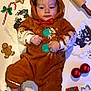 Anakin joined the competition — help win amazing prizes! baby, candy_cane, child, christmas_ornaments, cookie_cutters, cute, decorations, festive, floor, flour, gift_box, gingerbread_costume, green_bow, holiday, indoors, messy, playful, red_bow, rolling_pin, smiling