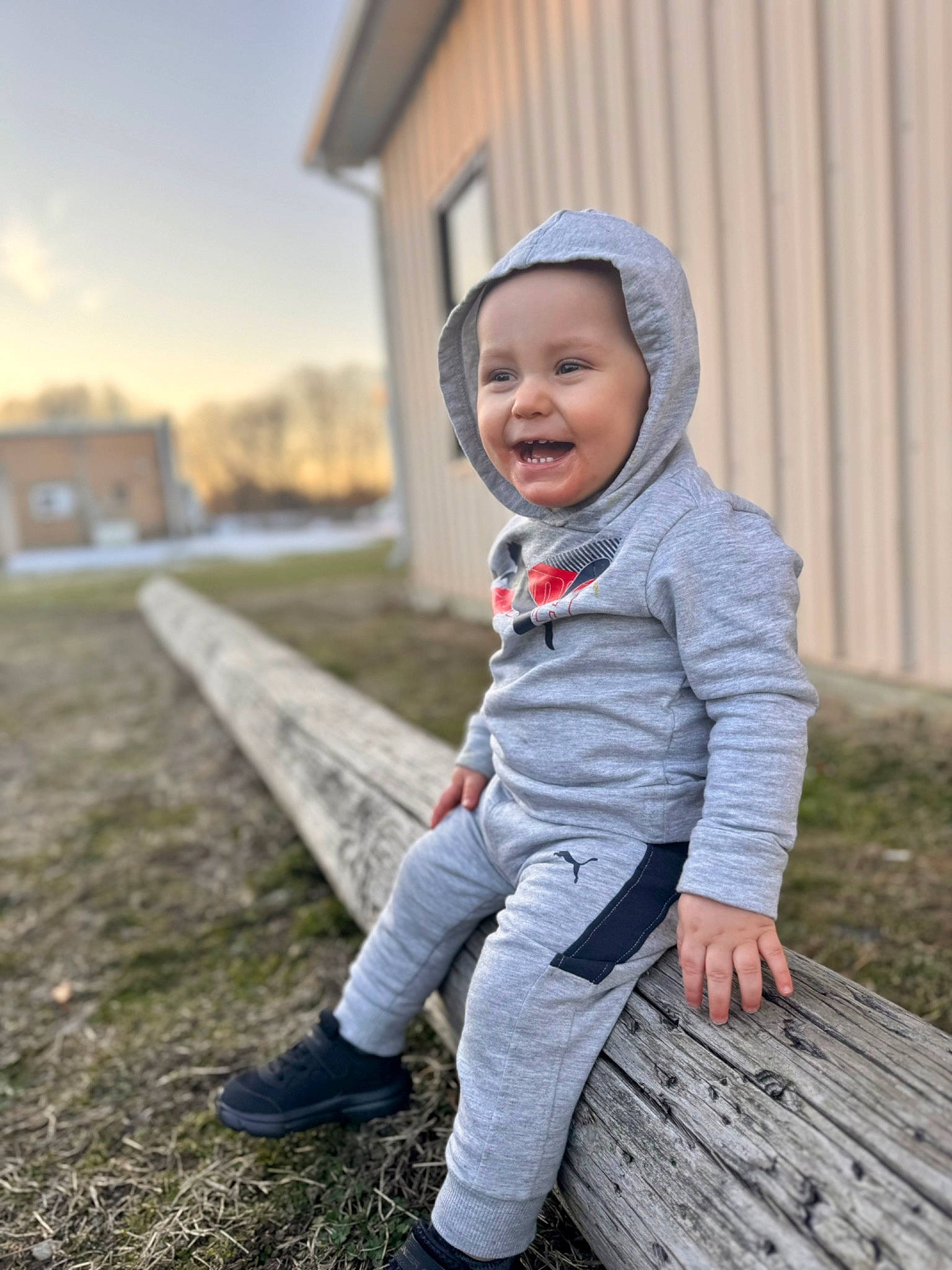 Sawyer is registered to the contest to win money with this photo: baby, baby_toddler_clothing, cap, child, facial_expression, flash_photography, fun, grass, happy, hat, headwear, joy, outerwear, people_in_nature, person, plant, shoe, sky, smile, sneakers
