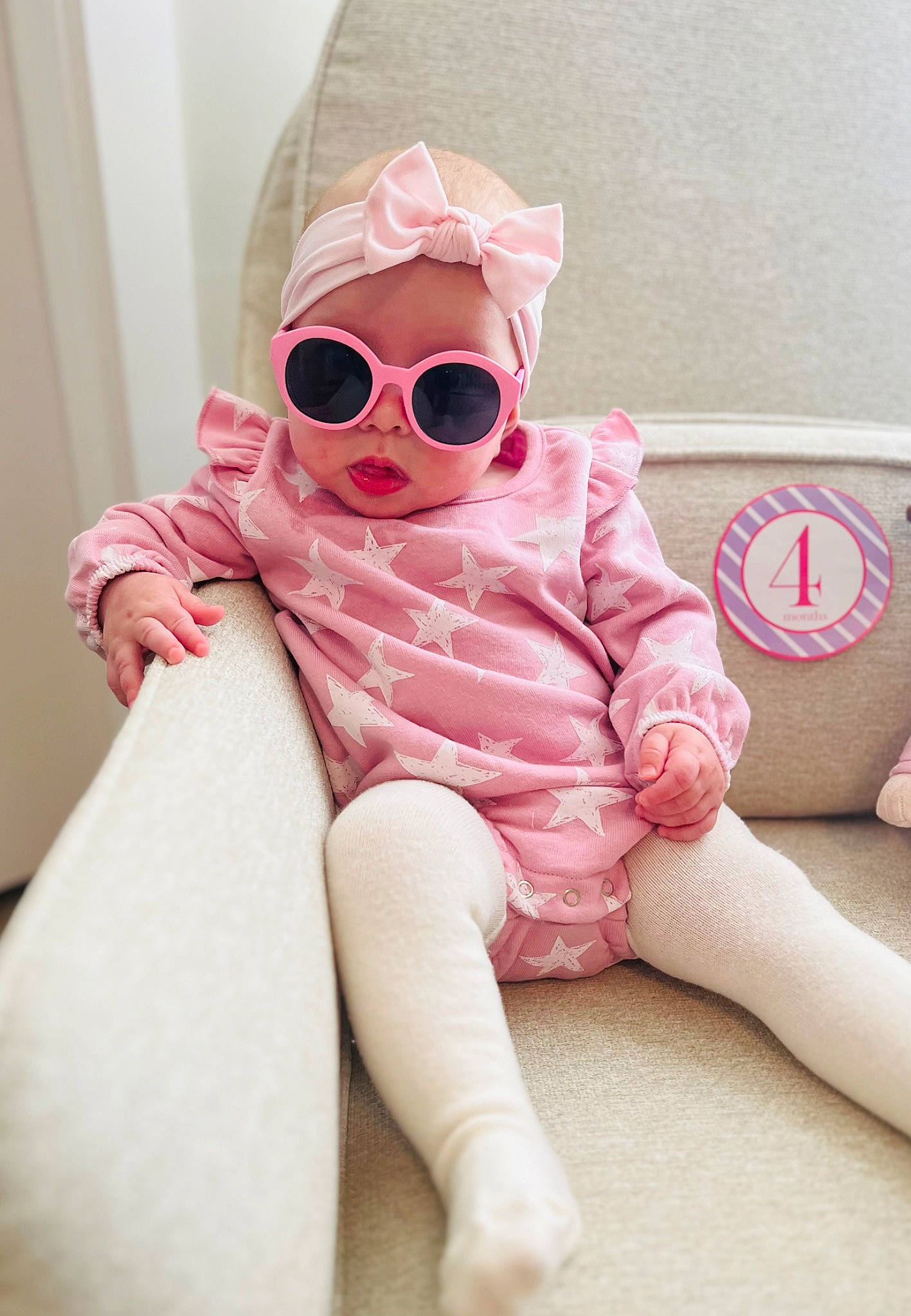 Jordyn joined the competition — help win amazing prizes! baby, baby_toddler_clothing, comfort, eyewear, face, finger, floor, glasses, goggles, head, headgear, human_body, leg, lip, person, pink, skin, sleeve, sunglasses, textile