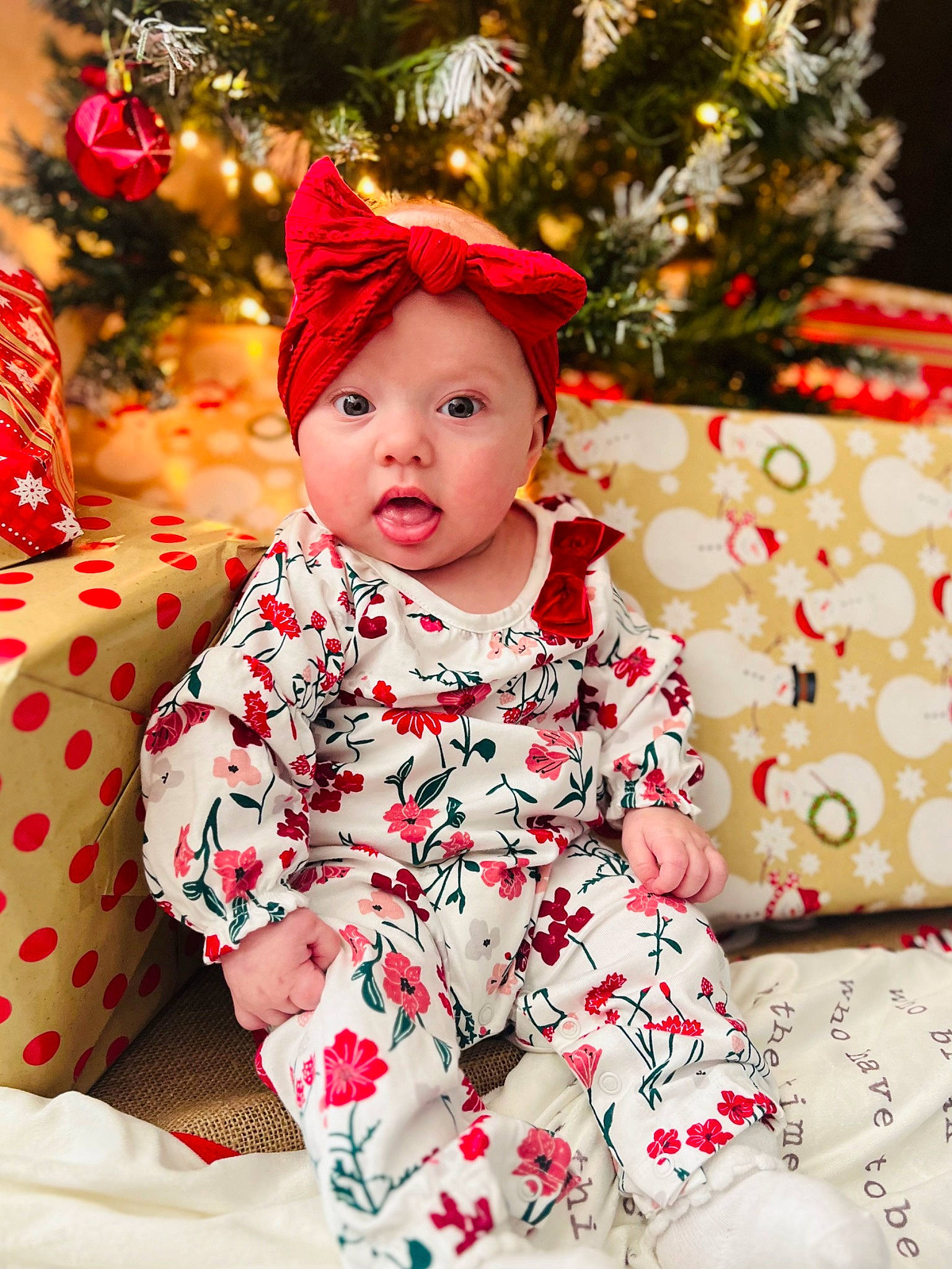 Jordyn joined the competition — help win amazing prizes! baby, baby_toddler_clothing, child, christmas_tree, clothing, dress, event, face, facial_expression, fun, happy, head, headwear, holiday, human_body, outerwear, pattern, person, plant, sleeve