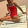 chair, child, daylight, fun, girl, goggles, happy, leisure, outdoor, person, playful, poolside, red, relaxing, skin, smile, summer, sunlight, swimsuit, vacation