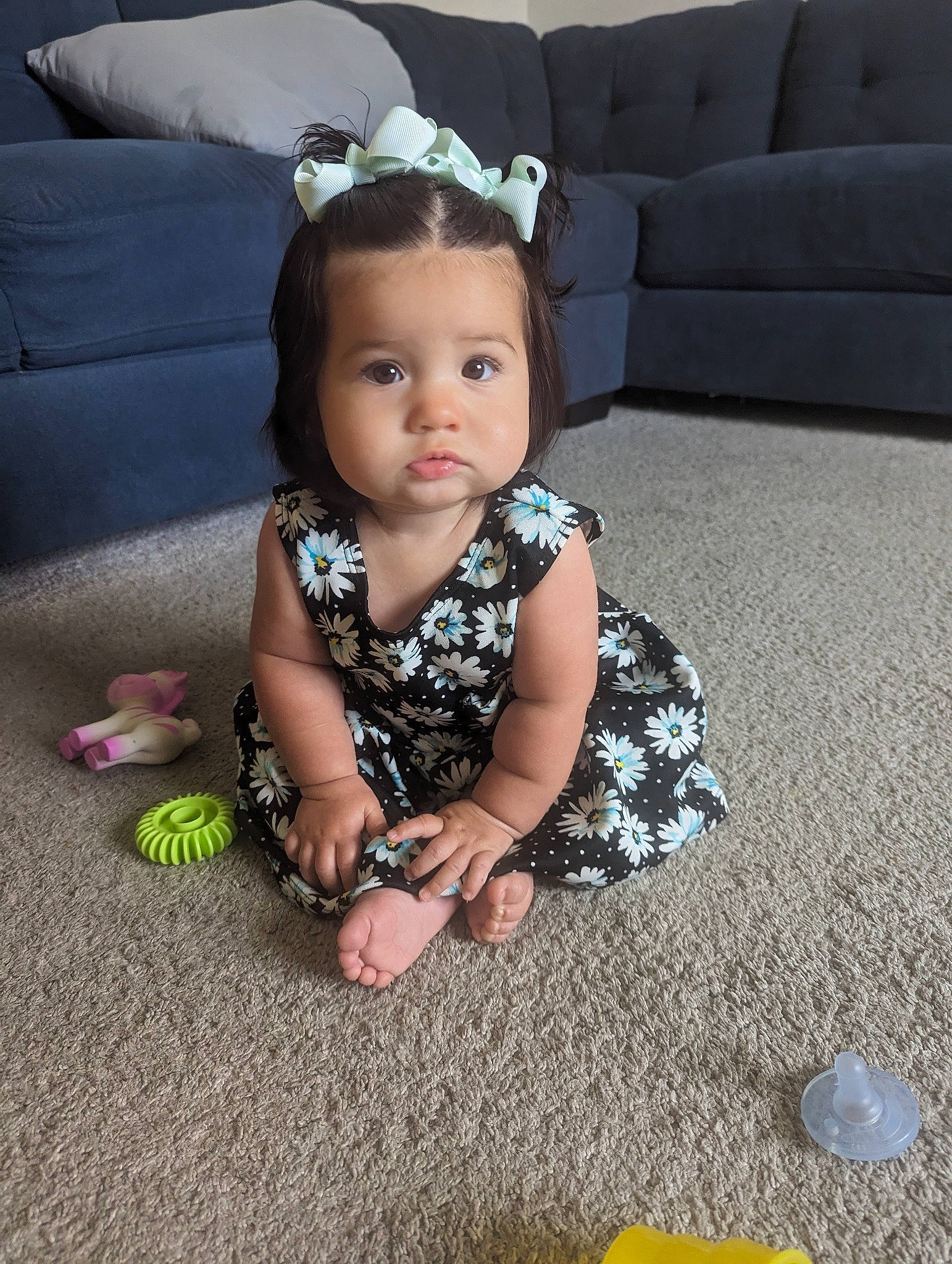 Malaya is registered to the contest to win money with this photo: baby, baby_toddler_clothing, blue, child, comfort, couch, dress, flash_photography, floor, flooring, fun, goggles, grass, person, sitting, skin, sleeve, textile, toddler, white