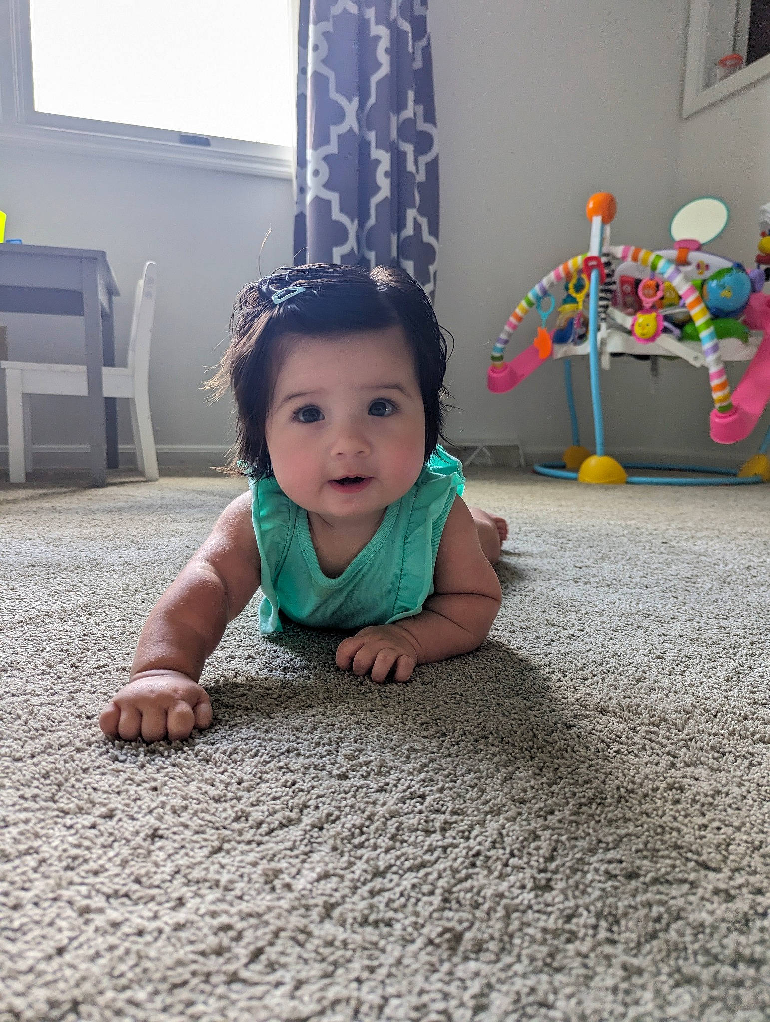 Malaya is registered to the contest to win money with this photo: asphalt, baby, baby_toddler_clothing, chair, child, crawling, curtain, fashion_accessory, floor, flooring, fun, grass, happy, hardwood, party_supply, person, road_surface, room, sitting, toddler