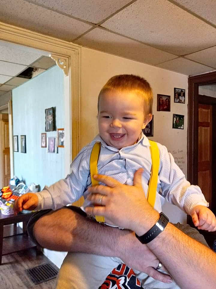 Harrison joined the competition — help win amazing prizes! baby, baby_toddler_clothing, ceiling, chair, comfort, drawer, flooring, fun, happy, human_leg, joy, lap, leg, person, picture_frame, sitting, smile, t_shirt, thigh, thumb