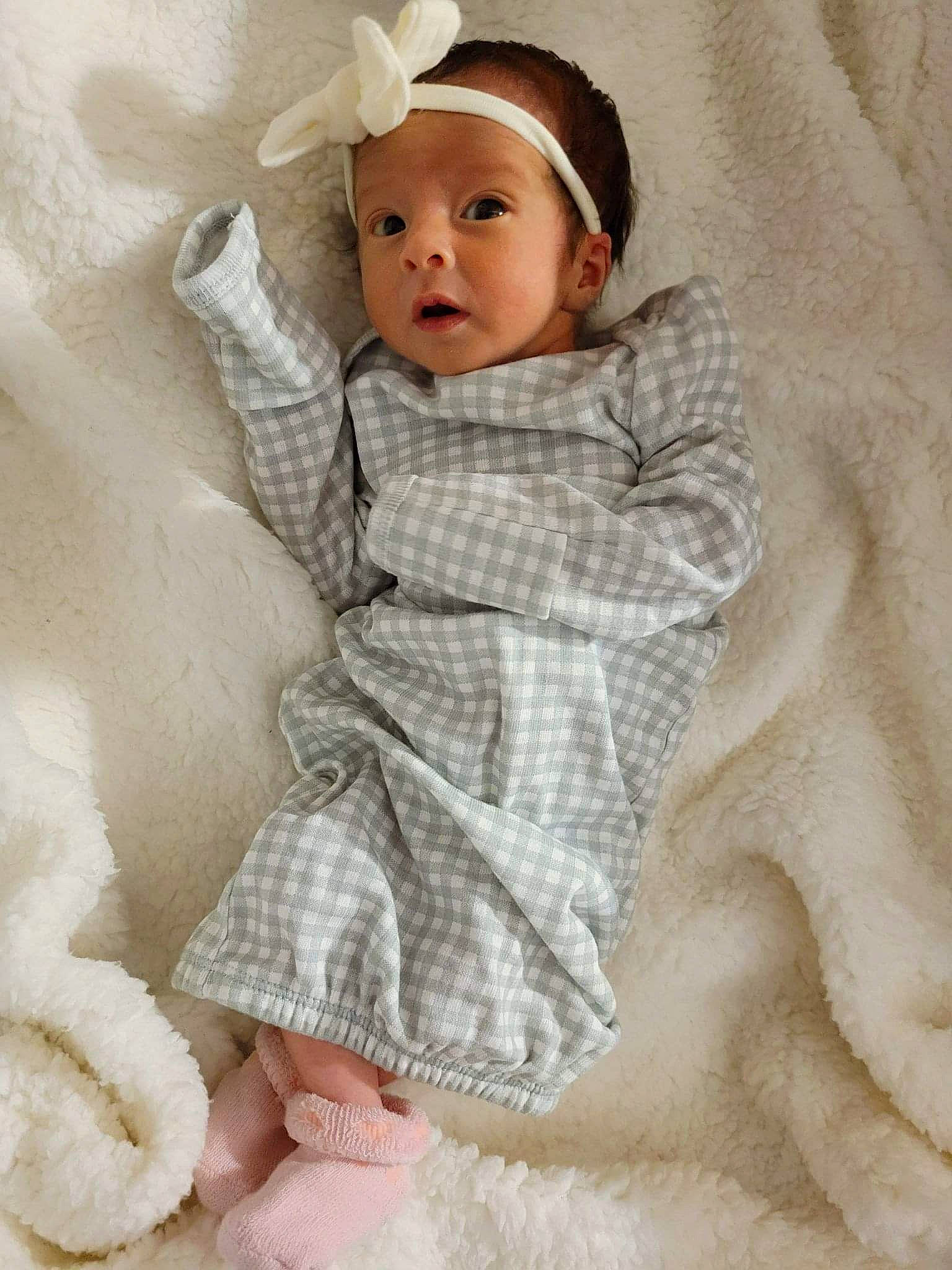 Vaida is registered to the contest to win money with this photo: baby, baby_toddler_clothing, cheek, child, clothing, comfort, dress, face, fashion_accessory, fur, head, iris, linens, lip, pattern, person, skin, sleeve, surprise, toddler