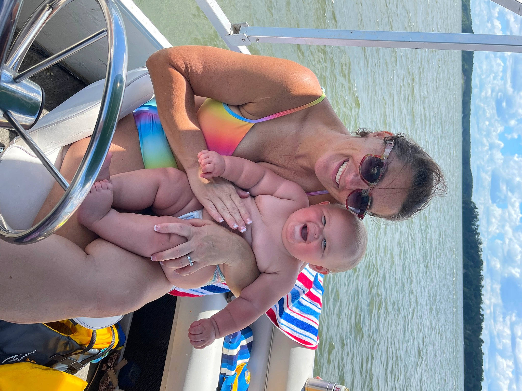 Braxton is registered to the contest to win money with this photo: arm, blue, brassiere, chest, eyewear, fun, goggles, headgear, human_leg, joy, leisure, muscle, person, personal_protective_equipment, recreation, shorts, summer, swimsuit_top, swimwear, thigh