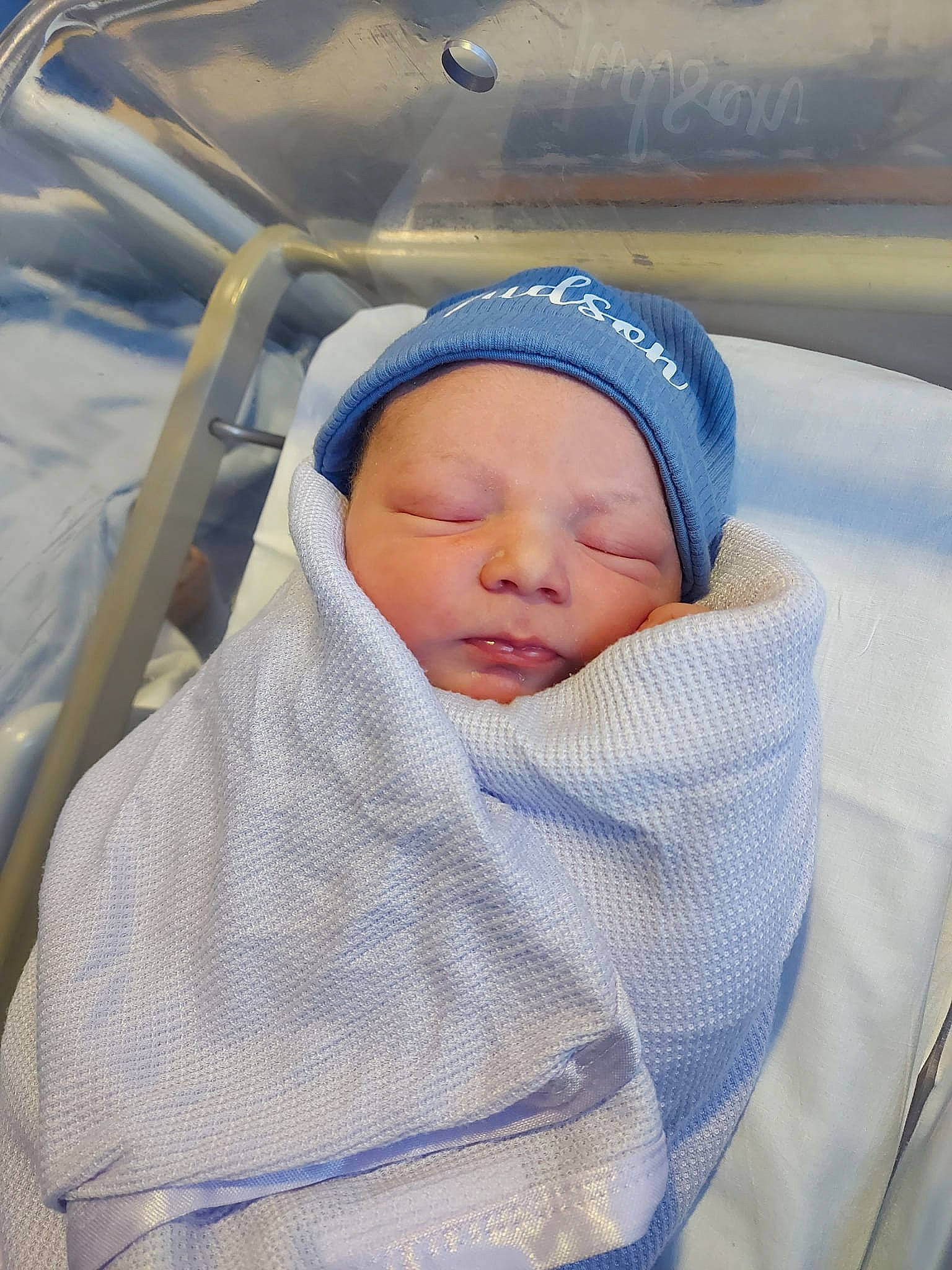 Judson is registered to the contest to win money with this photo: baby, baby_products, baby_safety, baby_sleeping, baby_toddler_clothing, beanie, bedtime, child, comfort, infant_bed, linens, nap, person, sleep, toddler, winter