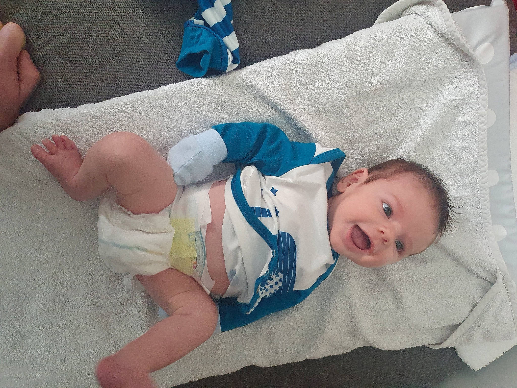 Elijah is registered to the contest to win money with this photo: abdomen, baby, baby_products, baby_sleeping, baby_toddler_clothing, child, comfort, eye, finger, head, health_care, human_body, knee, linens, person, room, skin, textile, thigh, thumb