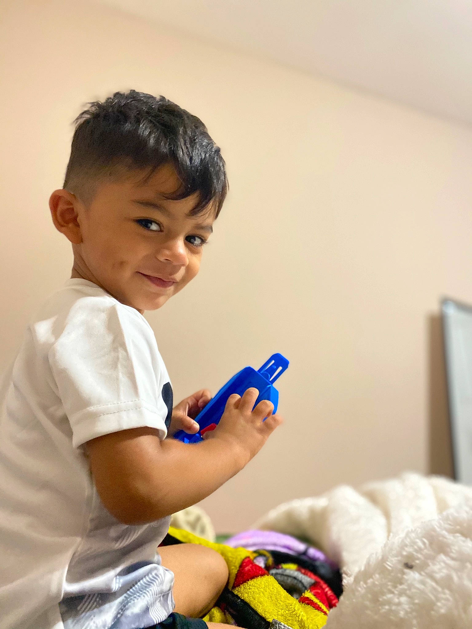 Iker is registered to the contest to win money with this photo: ankle, baby_playing_with_toys, baby_toddler_clothing, child, elbow, finger, joy, nail, person, plastic, play, plush, sock, stuffed_toy, wrist