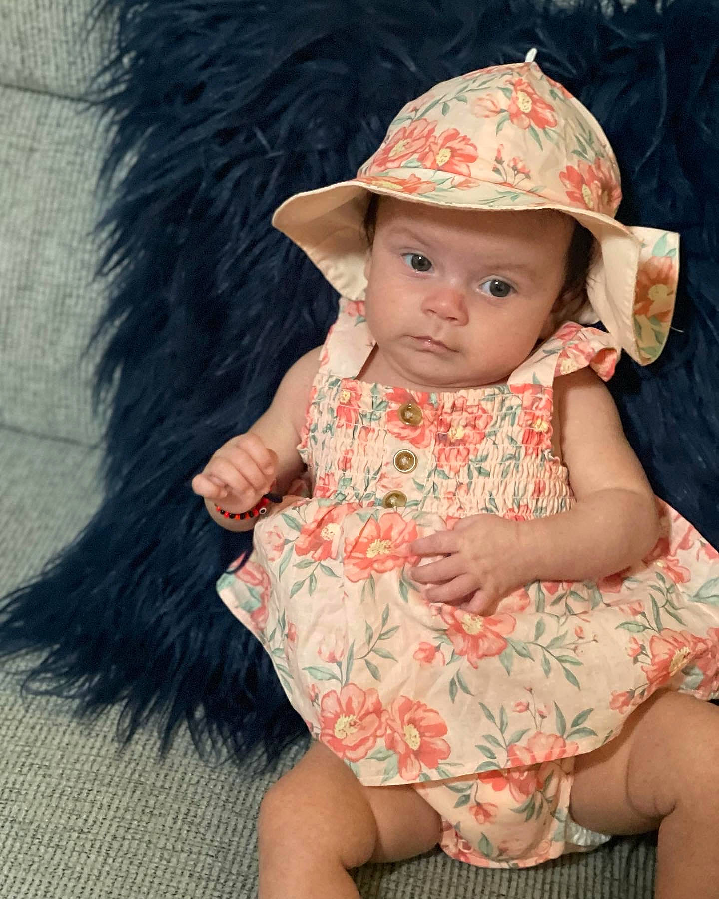 Azariah joined the competition — help win amazing prizes! baby, baby_toddler_clothing, cap, child, day_dress, dress, grass, happy, hat, headgear, headwear, human_leg, iris, lip, one_piece_garment, pattern, person, skin, sun_hat, textile