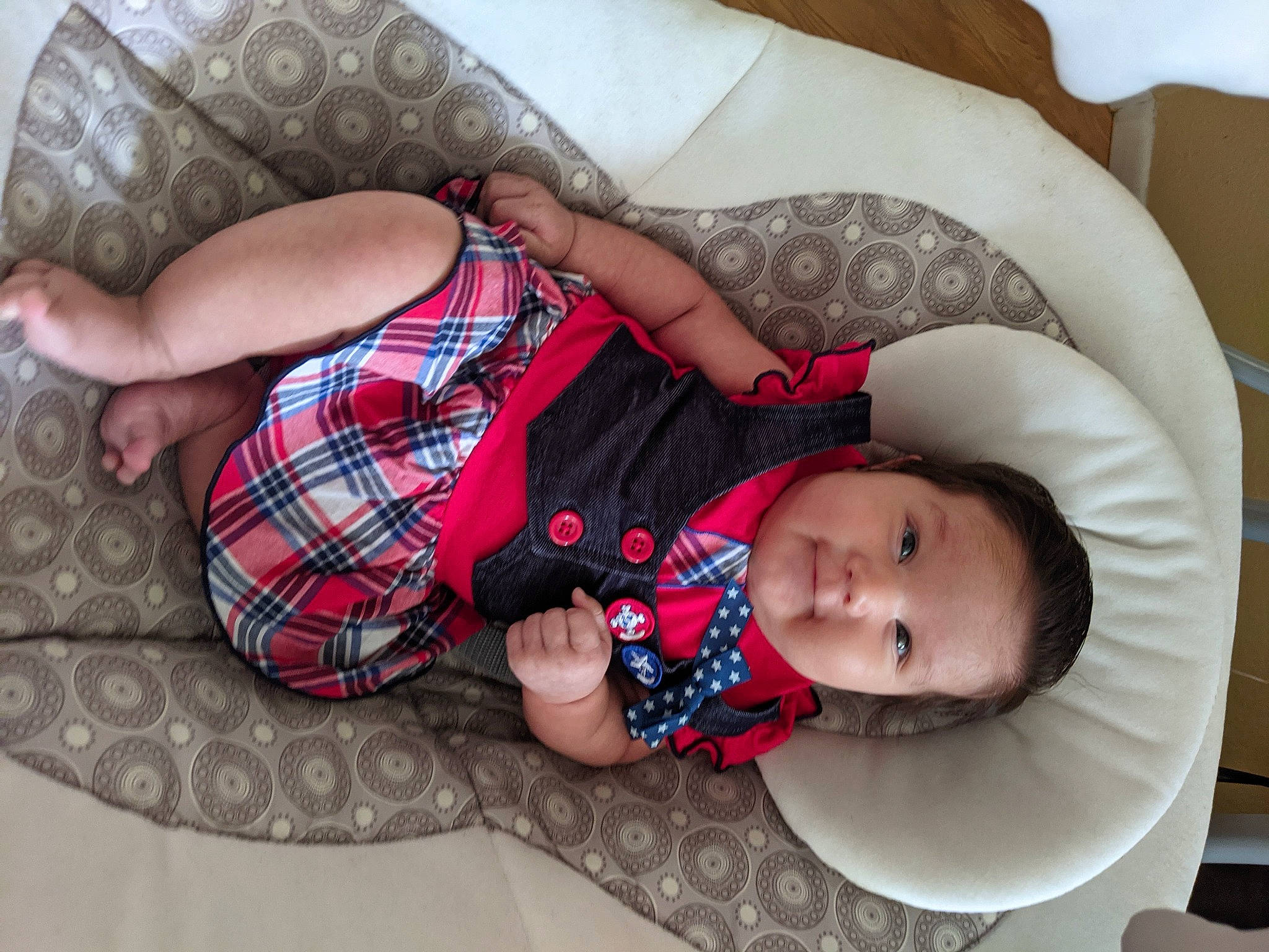Stevie Rose joined the competition — help win amazing prizes! arm, baby, baby_products, baby_toddler_clothing, child, comfort, couch, fashion_accessory, lap, linens, pattern, person, pink, plaid, product, sitting, skin, tartan, textile, thigh
