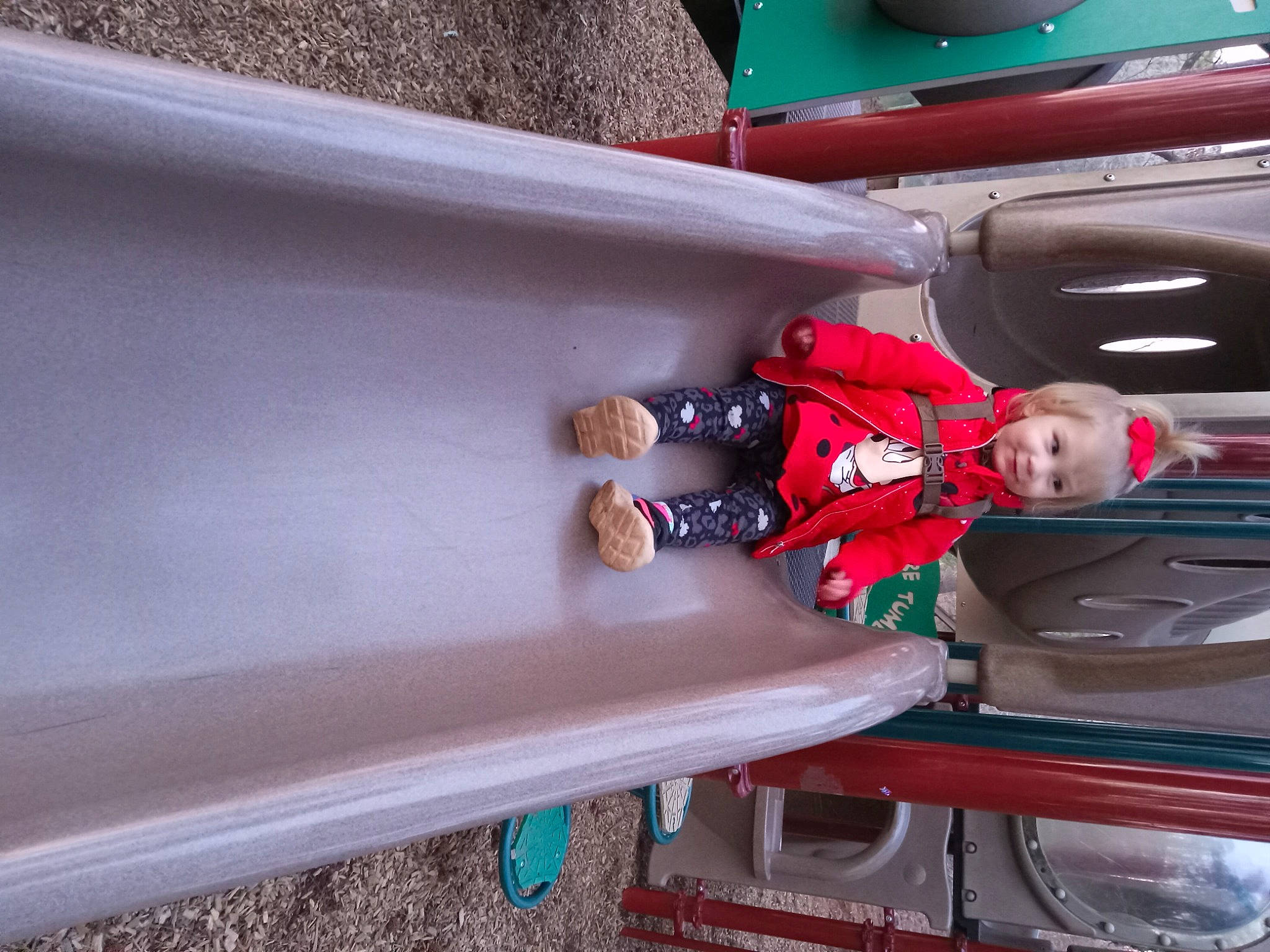 Tinsley is registered to the contest to win money with this photo: automotive_exterior, bumper, child, chute, elbow, fun, hat, leisure, machine, motor_vehicle, outdoor_play_equipment, person, recreation, room, toddler, vehicle, vehicle_door, wood