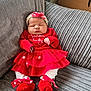 baby, infant, sleeping, red_clothing, headband, polka_dot, couch, gray_couch, soft_texture, festive, holiday, tutu_skirt, baby_shoes, white_tights, indoors, cute, peaceful, child, portrait, cozy