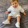 toddler, child, white_outfit, bow_tie, sneakers, sitting, gray_blanket, cute, portrait, indoors, baby, smiling, happy, young_child, fashion, footwear, soft_texture, casual, person, closeup
