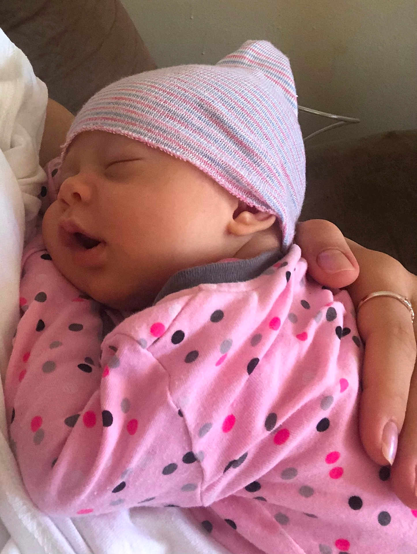 Nitsa joined the competition — help win amazing prizes! baby, newborn, sleeping, hat, pink_clothing, polka_dot, arm, hand, person, indoor, couch, closeup, face, infant, cute, cozy, soft, rest, child, portrait