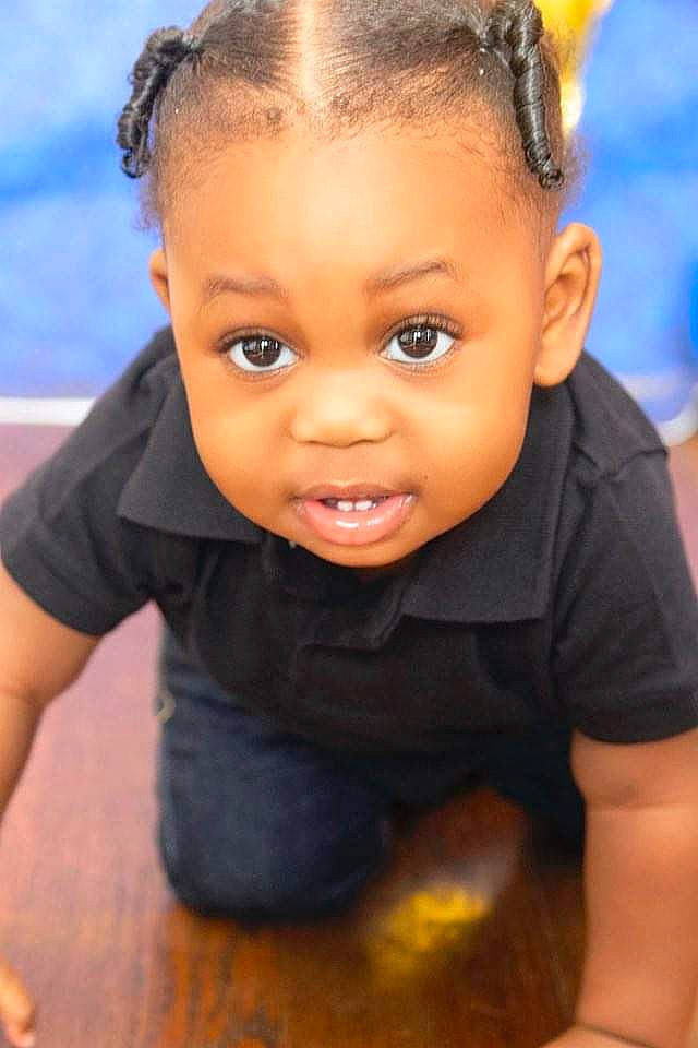 Kace is registered to the contest to win money with this photo: arm, black_hair, cheek, child, eyebrow, eyelash, flash_photography, flooring, forehead, fun, happy, iris, lip, nose, organ, person, skin, smile, t_shirt, toddler