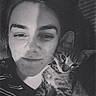 Rogue joined the competition — help win amazing prizes! person, cat, kitten, tabby, black_and_white, selfie, face, pet, animal, striped, close_up, cuddle, companion, indoor, portrait, young_adult, casual, striped_shirt, relaxation, affection