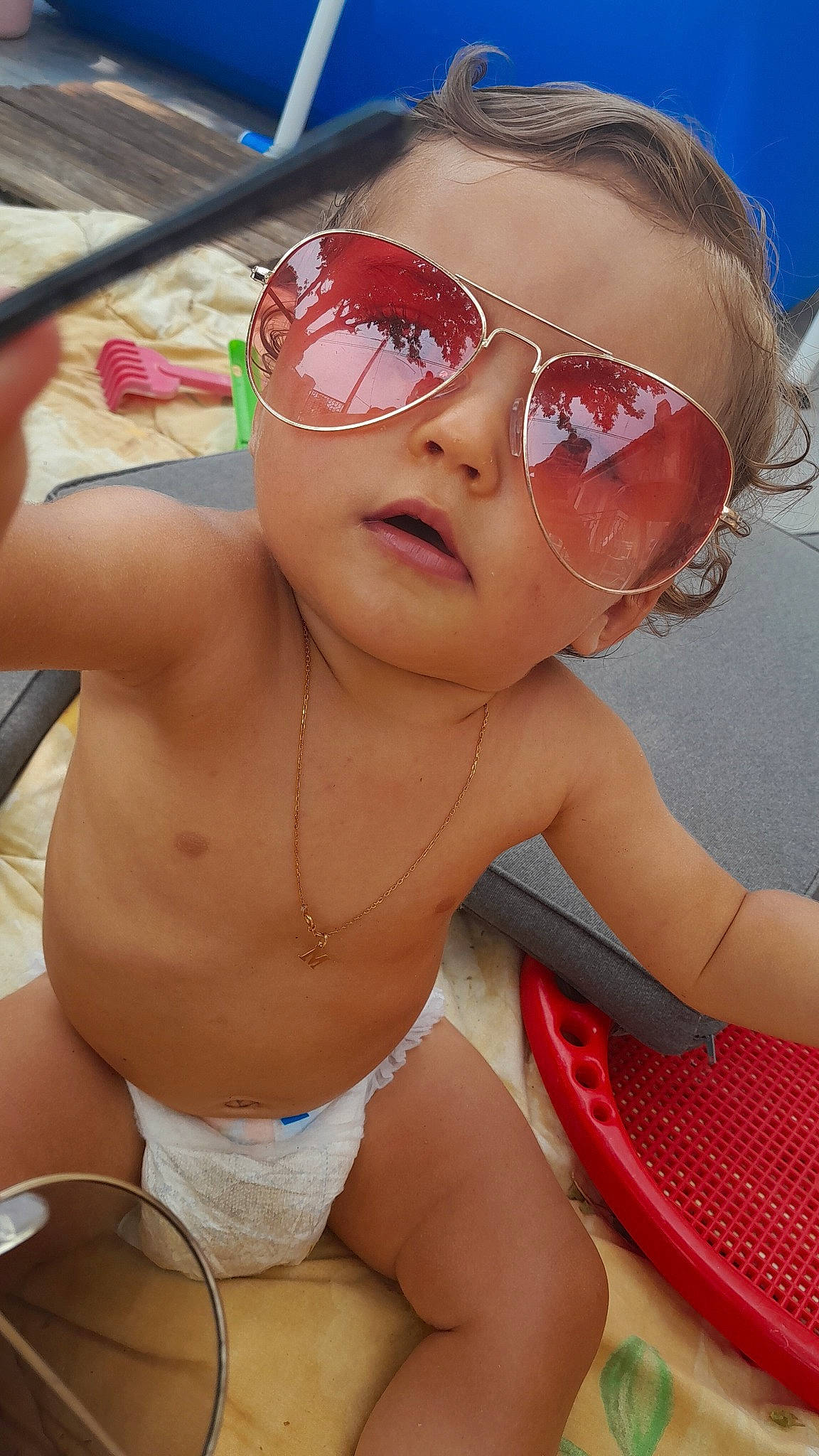 Marley participe au concours pour gagner de l'argent avec cette photo : cap, cool, eyewear, face, glasses, goggles, happy, hat, head, headgear, lip, mouth, person, pink, skin, sunglasses, swimming_pool, swimwear, toddler, vision_care
