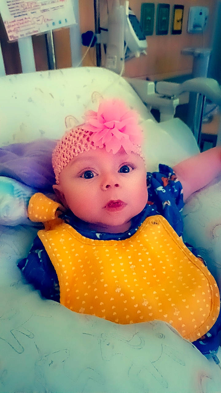 Elana joined the competition — help win amazing prizes! baby, baby_products, baby_toddler_clothing, baby_toys, bathing, chair, cheek, child, doll, eyelash, fun, happy, headgear, headwear, magenta, pattern, person, plastic, room, sitting