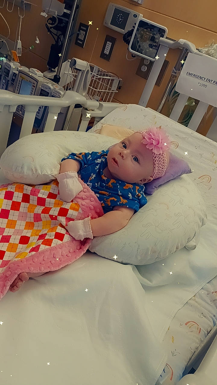 Elana joined the competition — help win amazing prizes! baby, baby_toddler_clothing, bed, bed_sheet, bedding, blanket, chair, child, comfort, event, hat, headwear, linens, pattern, person, pillow, pink, product, room, throw_pillow