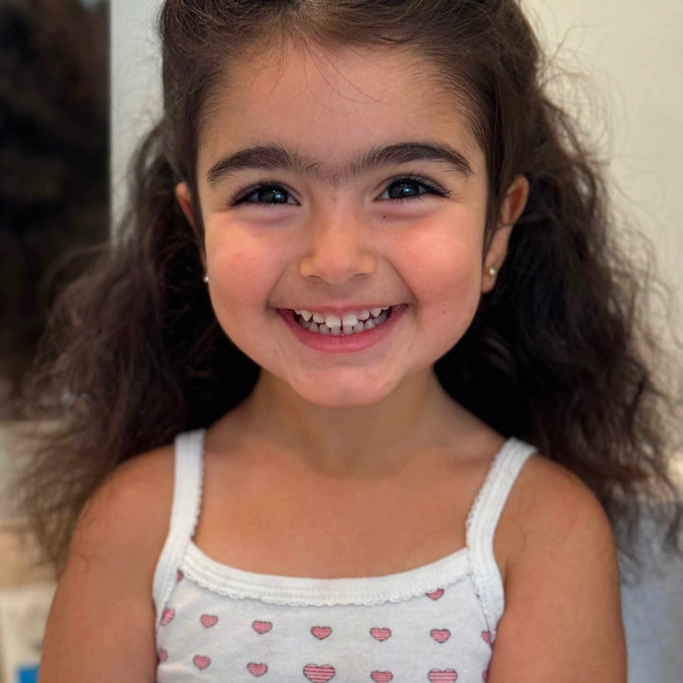 Mane is registered to the contest to win money with this photo: accessories, bodypart, child, clothing, dimples, earring, face, female, girl, happy, head, jewelry, mouth, person, photography, portrait, shoulder, smile, tanktop, teeth