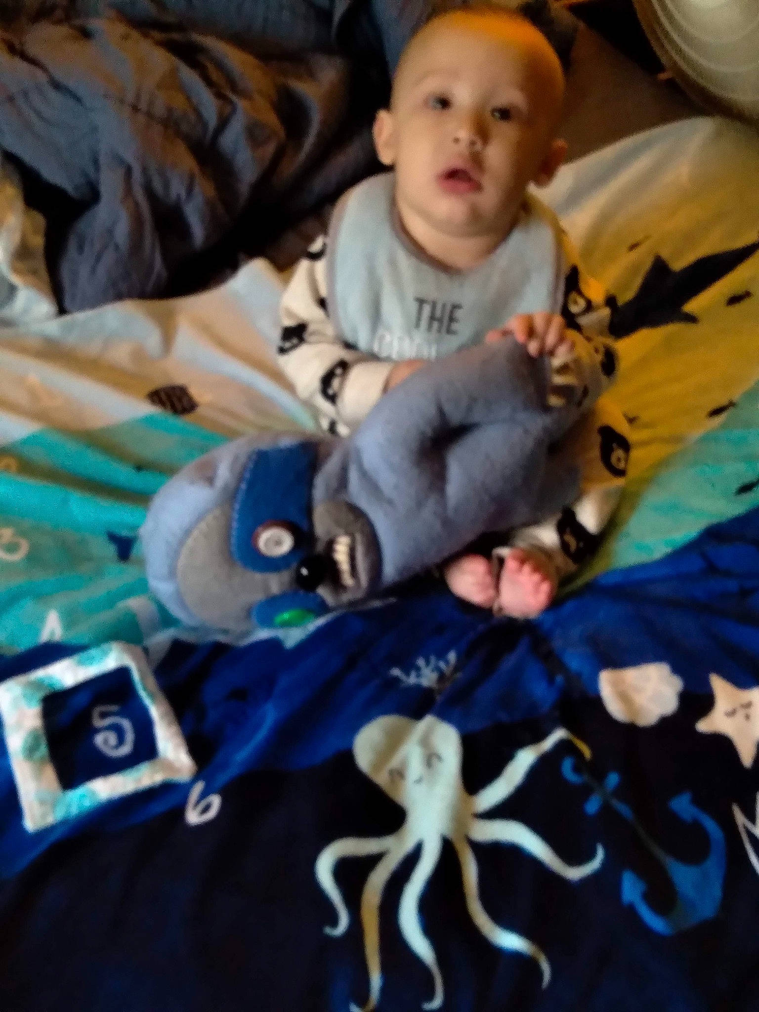 Exavier is registered to the contest to win money with this photo: baby, baby_products, child, comfort, communication_device, electric_blue, fun, happy, leisure, linens, mobile_phone, person, room, sitting, textile, toddler, vacation