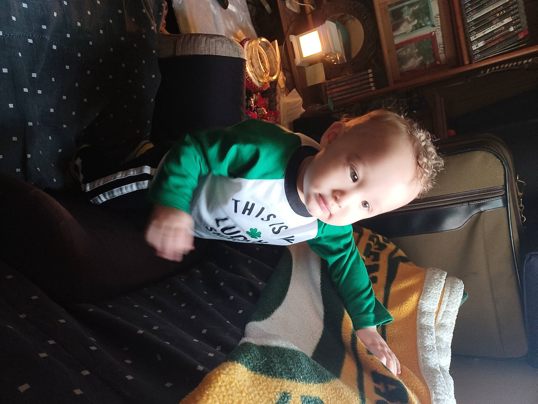 Exavier is registered to the contest to win money with this photo: baby, child, comfort, elbow, event, fashion, flash_photography, fun, human_leg, knee, leg, pattern, person, picture_frame, room, sitting, sleeve, t_shirt, thigh, toddler