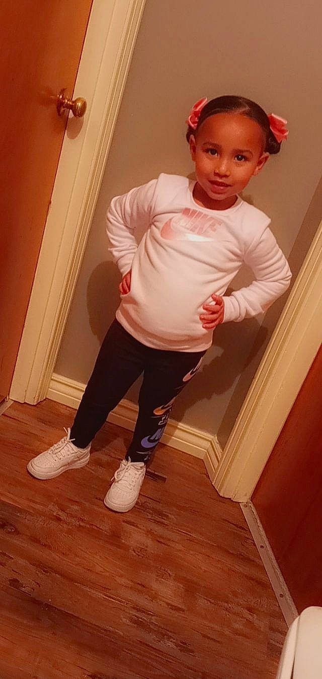 Aliyanna is registered to the contest to win money with this photo: baby_toddler_clothing, door, elbow, flooring, hair, hardwood, head, human_leg, joy, knee, leg, neck, person, sleeve, sportswear, t_shirt, thigh, toddler, waist, wood