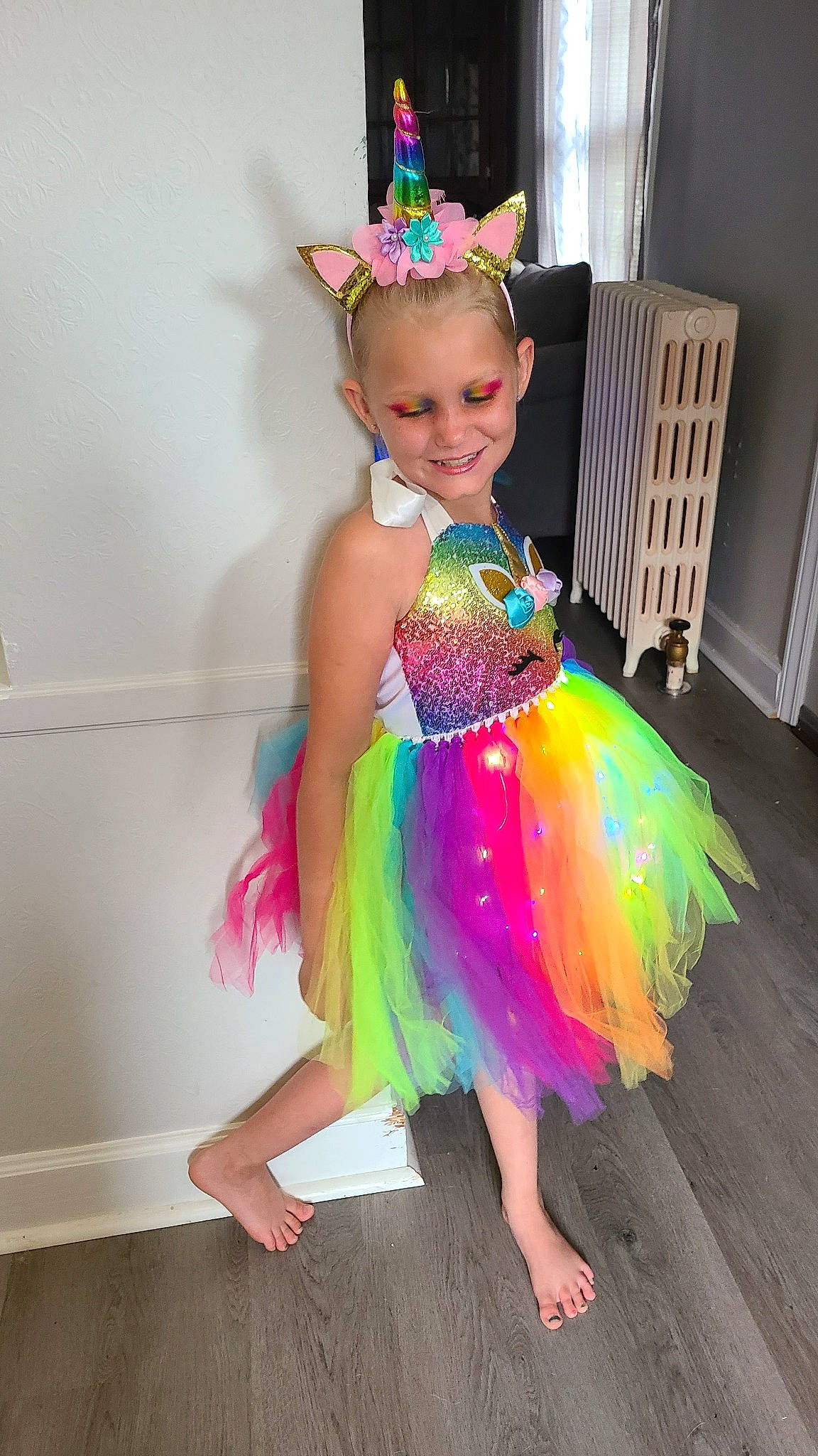 Layla is registered to the contest to win money with this photo: baby_toddler_clothing, ballet_tutu, child, clothing, costume, entertainment, event, fashion_accessory, fashion_design, fun, happy, headpiece, joy, magenta, mythical_creature, party_supply, performing_arts, person, pink, purple