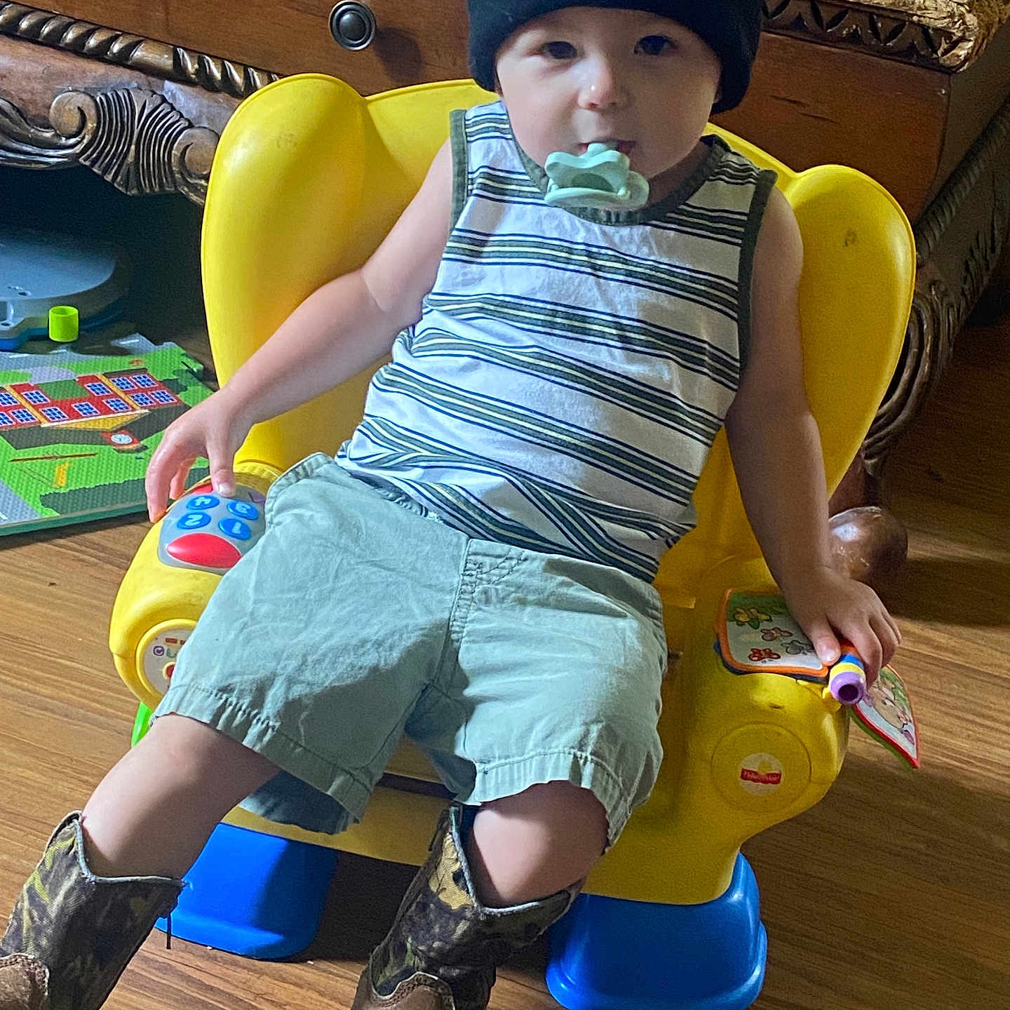 Diesel joined the competition — help win amazing prizes! beanie, boots, casual, child, cute, floor, furniture, home, indoor, pacifier, person, playtime, relaxed, shorts, smiley_face, striped_shirt, toddler, toy, wooden_floor, yellow_chair