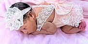 Aurora is registered to the contest to win money with this photo: baby, infant, newborn, lace, headband, pink, blanket, soft, cute, sleeping, skin, foot, hand, person, child, portrait, laying, cozy, clothing, fabric