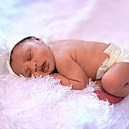 Aurora joined the competition — help win amazing prizes! baby, newborn, sleeping, diaper, hat, flower, fluffy_blanket, soft_texture, peaceful, cute, infant, skin, closeup, portrait, resting, child, nursery, cozy, warm, toddler