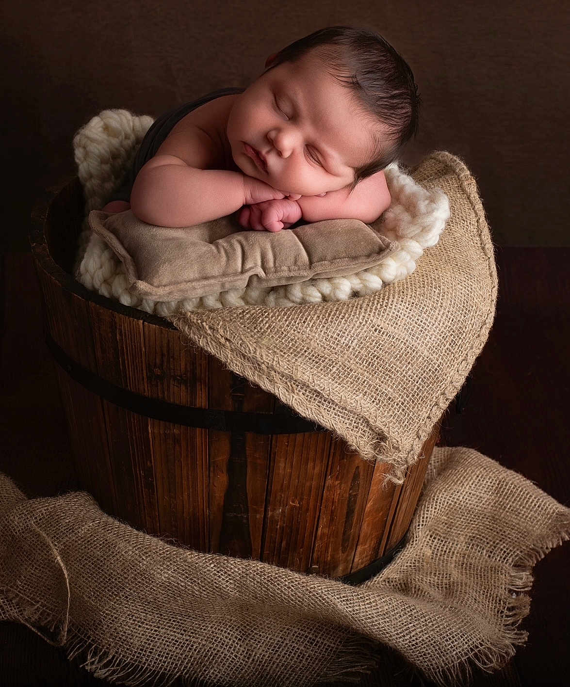 Dhilan joined the competition — help win amazing prizes! baby, sleeping, wooden_bucket, pillow, knitted_blanket, burlap, cozy, portrait, infant, resting, soft_texture, warm_lighting, indoors, cute, peaceful, newborn, child, wrapped, skin, head